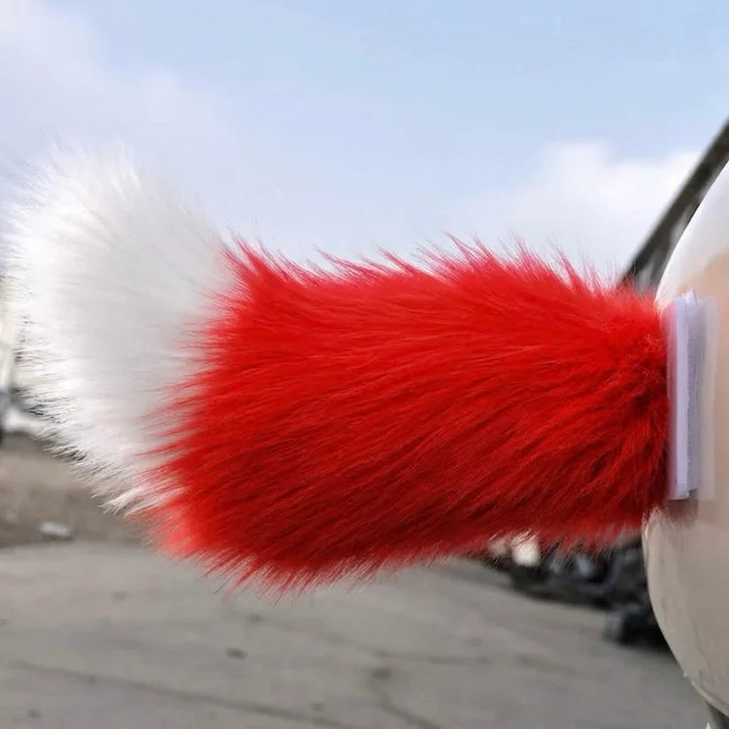 Red moving tail accessory attached to a vehicle