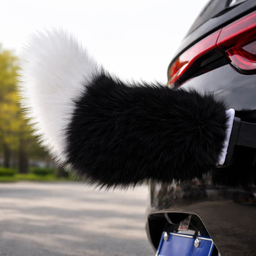 Black moving tail accessory attached to a car
