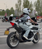 White motorcycle and rider in a white helmet — TAILDASH